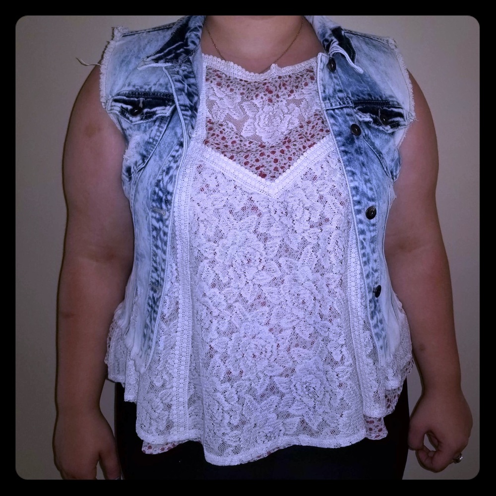 Bleached and ripped jean vest
